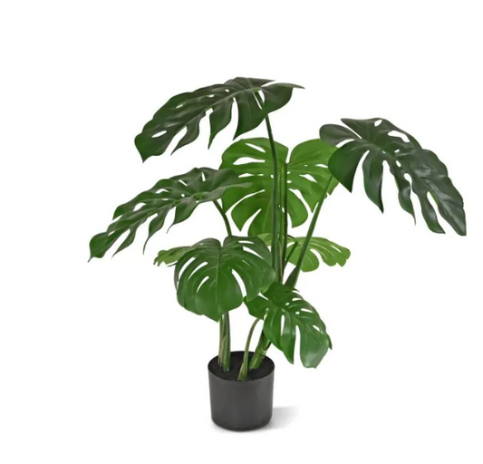 Moderne werkruimte met kunstplanten die zorgen voor een nette, duurzame en uitnodigende kantooromgeving.